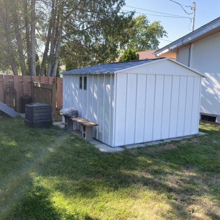 Shed With Fresh Coats Of Paint On The Walls & Roof