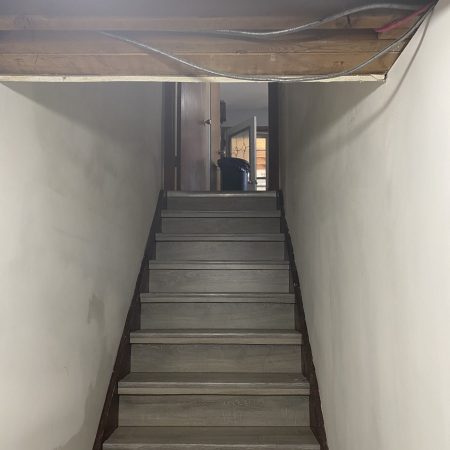 Basement Staircase With New Flooring Finish