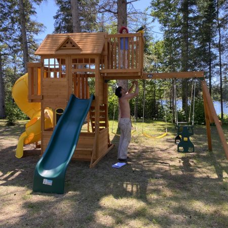 Wooden Play Structure Assembly With A Happy Client